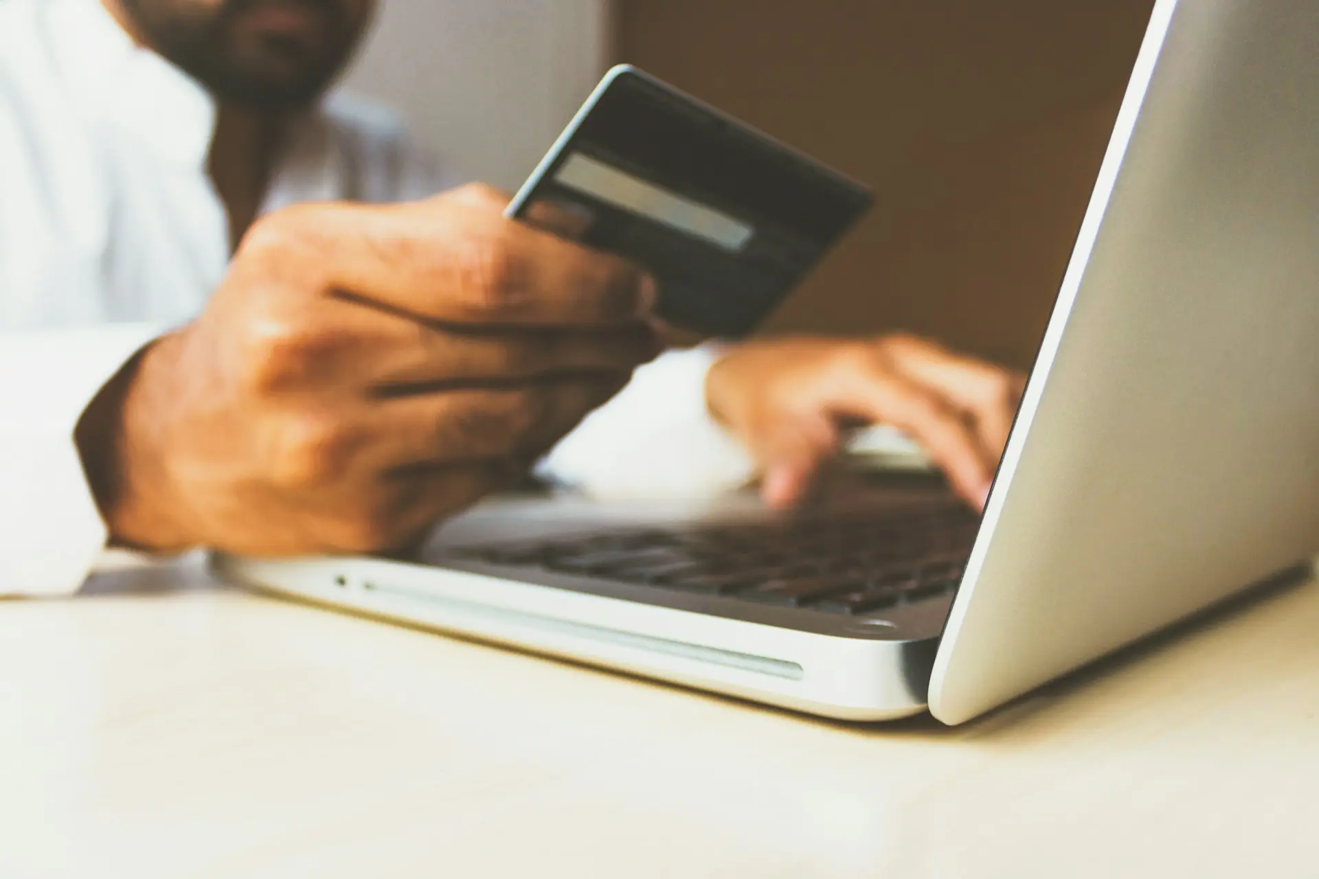 person paying a bill online -paying fees for criminal cases in Arizona