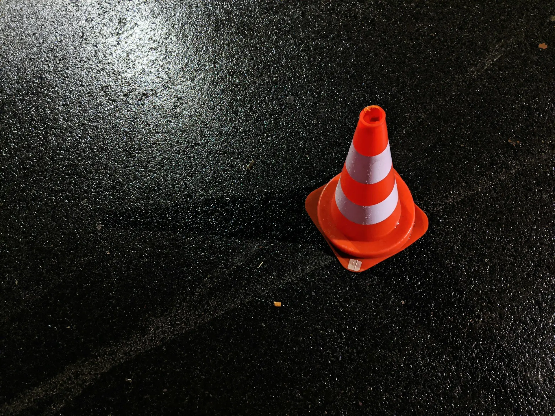 orange cone on black ground