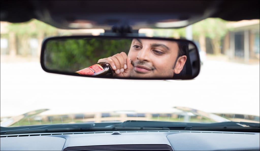 Man drinking and driving