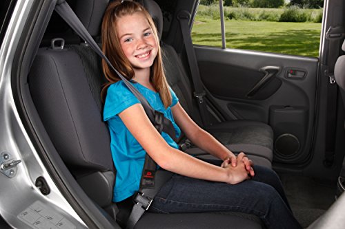 buckled little girl sitting in backseat of car