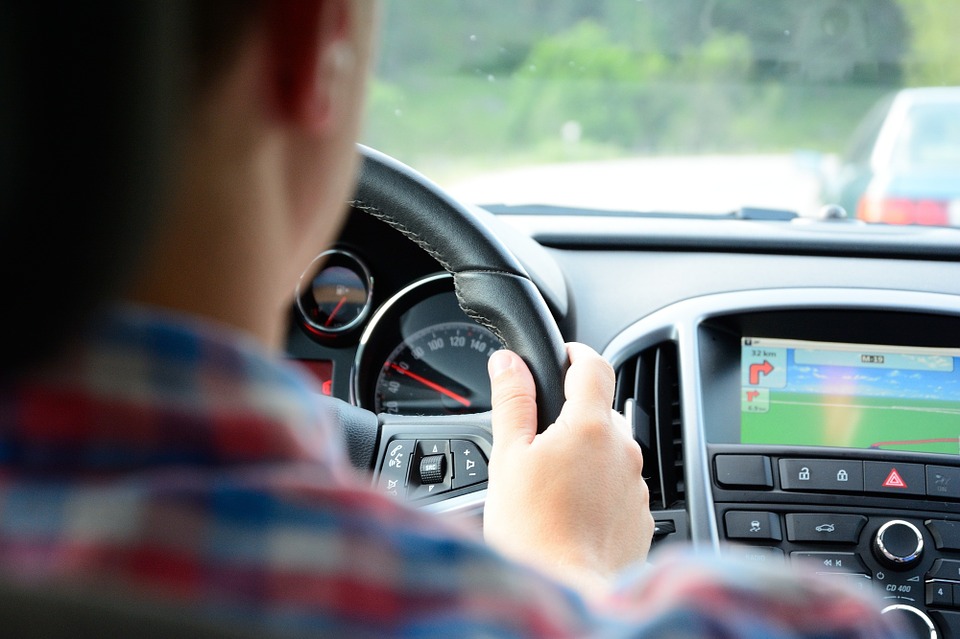 man safely driving car with GPS