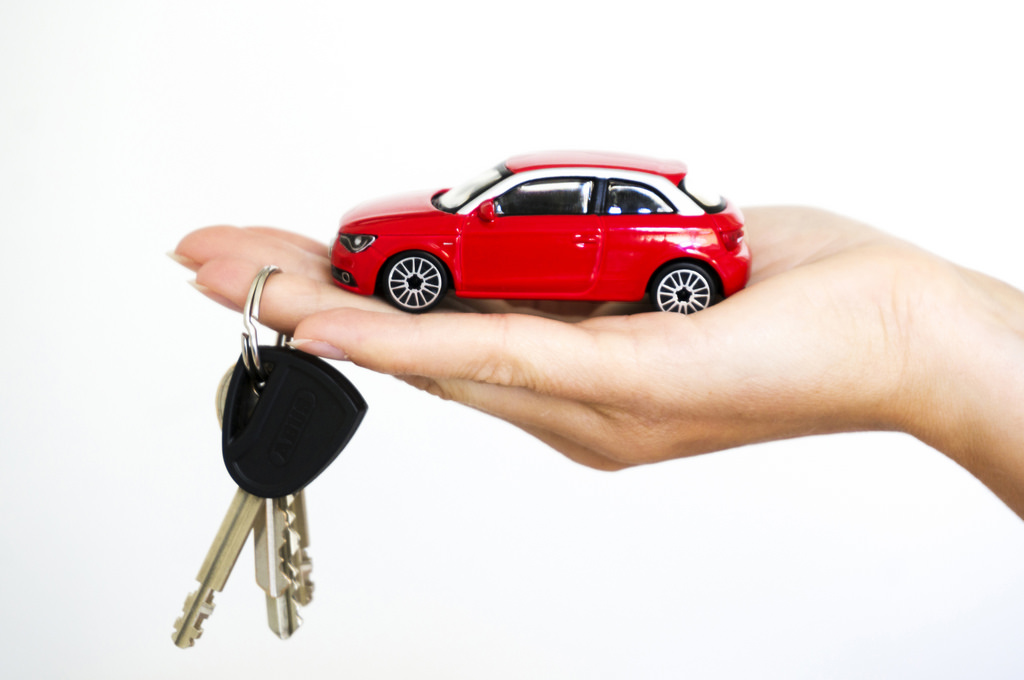 holding car and keys