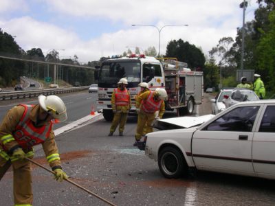 Road crew cleaning up car accident