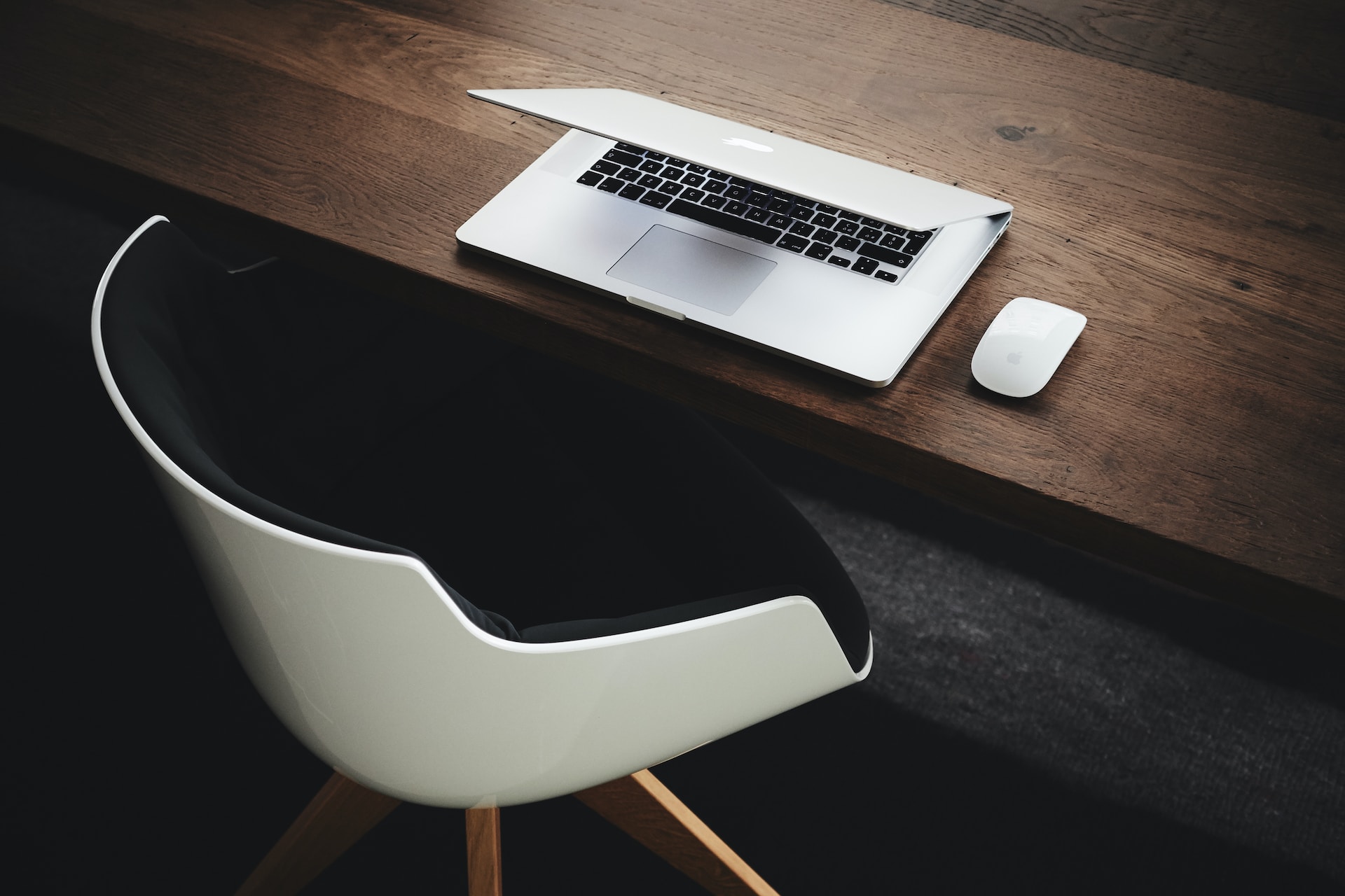 white computer chair and desk with laptop -white collar crime